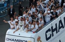 Real Madrid players parade the Champions League trophy on an open top bus after they won it for the 15th time at Wembley on Saturday