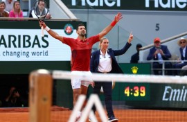 Serbia's Novak Djokovic (L) celebrates the winning point of his five-set victory over Francisco Cerundolo