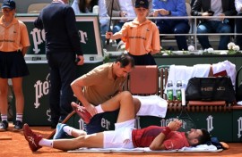 Novak Djokovic received treatment during his victory against Francisco Cerundolo at the French Open after which he withdrew with a knee injury