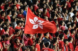 In this picture taken in 2017, Hong Kong fans hold their flag during a match