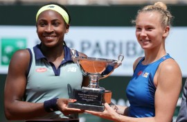 Coco Gauff (L) has now won Grand Slam titles in both singles and doubles at the age of just 20