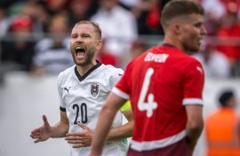 Austria's midfielder Konrad Laimer (L) and Switzerland defender Nico Elvedi featured at the Kybunpark