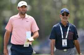 World number one Scottie Scheffler, left, walks with golf instructor Claude Harmon III on the fourth hole during a practice round ahead of Thursday's start of the 124th US Open at Pinehurst