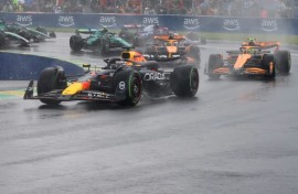 Max Verstappen leads Lando Norris as the spray flies at the Canadian  Grand Prix