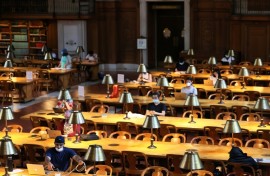 People read their computers in the New York Public Library in July 2021 in Manhattan 