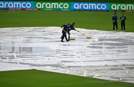 Match officials wipe water from the pitch but the ICC men's Twenty20 World Cup 2024 group D cricket match between Sri Lanka and Nepal at Central Broward Park was ultimately called off