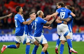 Italy players celebrate with Nicolo Barella after he scored what proved to be his side's winner against Albania