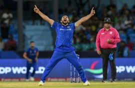 Afghanistan's Gulbadin Naib celebrates after the dismissal of  Australia's Glenn Maxwell during the T20 World Cup Super Eights match on Saturday.