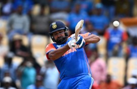 On the attack: India captain Rohit Sharma hits a four during his 92 against Australia in a T20 World Cup Super Eights match in St. Lucia