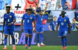 Kylian Mbappe removed his mask to celebrate scoring a penalty to put France ahead but they were frustrated by Poland