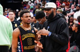 Bronny James, left, was selected by the Los Angeles Lakers with the 55th pick in the NBA Draft and could become the first NBA father-son combination playing for the Lakers alongside his superstar father, LeBron James, right