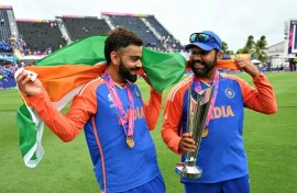 Virat Kohli and Rohit Sharma celebrate with the trophy after winning the ICC men's Twenty20 World Cup 2024 final cricket match between India and South Africa 