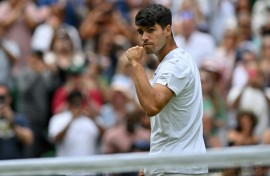 Champion: Carlos Alcaraz celebrates winning against Mark Lajal in the first round 