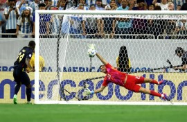 Argentina goalkeeper Emi Martinez saves from Ecuador's Alan Minda in Thursday's Copa America quarter-final thriller