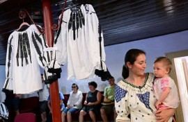 Examples of traditional Romanian blouses at a show in Vaideeni