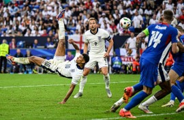 England's Jude Bellingham (left)is free to play against Switzerland after only receiving a suspended ban and fine for his gesture against Slovakia