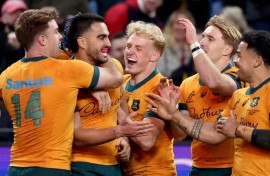 Australia celebrate after beating Wales 25-16
