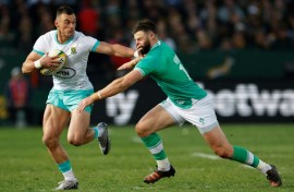 South African Jesse Kriel (L) hands off fellow centre Robbie Henshaw of Ireland during the first Test in Pretoria.
