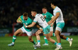 South Africa centre Jesse Kriel (2nd L) tackles Ireland fly-half Jack Crowley during the first Test in Pretoria. 
