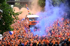Dutch fans cheer in the streets of Dortmund ahead of Netherlands' Euro 2024 semi-final clash with England