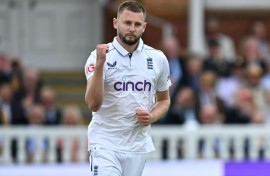 On his way: England's Gus Atkinson celebrates after dismissing West Indies captain Kraigg Brathwaite, his maiden wicket in a debut haul of 7-45 in the first Test at Lord's