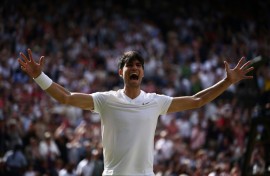 Carlos Alcaraz celebrates beating Novak Djokovic to retain his Wimbledon title