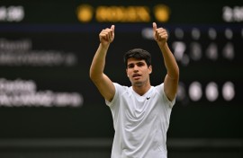 Defending champion Carlos Alcaraz celebrates reaching the Wimbledon final