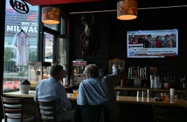 Milwaukee residents watch news of the assassination attempt on Donald Trump at a bar