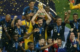 Olivier Giroud holds aloft the World Cup trophy in 2018