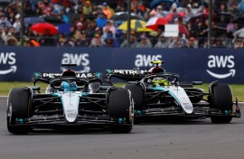 Mercedes' drivers Lewis Hamilton and George Russell (L) competing at the Formula One British Grand Prix at Silverstone