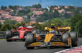 McLaren's British driver Lando Norris (R) at the Hungaroring race track in Mogyorod near Budapest