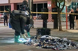 A South Korean Defence Ministry handout picture shows officers in Paju picking through trash sent by balloon from North Korea in early June 2024