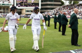Undefeated: England's Harry Brook (L) and Joe Root return to the pavilion after an unbroken century stand in the second Test against the West Indies at Trent Bridge  
