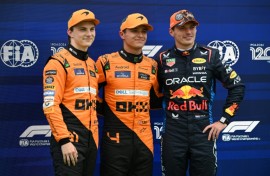 Max Verstappen (right) was overshadowed by the McLaren men in qualifying for Sunday's Hungarian Grand Prix 