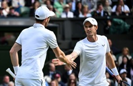End of the road: Britain's Andy Murray (R) with brother Jamie Murray in action at Wimbledon this year