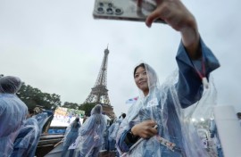 As the South Korean delegation rode a boat on the Seine River, the French-speaking presenter introduced them using the official name for North Korea
