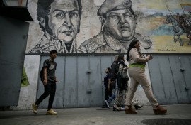 Graffiti depicting liberator Simon Bolivar and Venezuelan late president Hugo Chavez in Caracas in April 2024