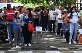 People queue at a polling station in Caracas