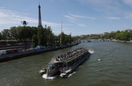 A tourist boat on the Seine river in Paris which is due to hold the swimming event in the Olympic triathlon