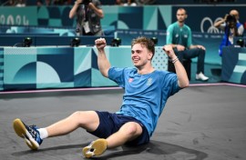 Sweden's Truls Moregard celebrates after winning against China's Wang Chuqin 