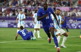 Jean-Philippe Mateta runs away in celebration after scoring for France against Argentina