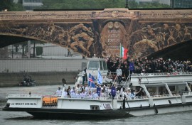 Chad's flag bearer Madaye Israel waves his country's flag (top right)at the Olympics opening ceremony in Paris