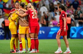 Canada players react after their penalty shoot-out defeat at the hands of Germany in Marseille