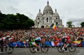 Gold medallist Remco Evenepoel racing past the Sacre Coeur cathedral during the men's cycling road race 
