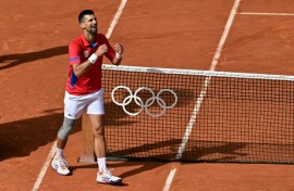 Serbia's Novak Djokovic celebrates becoming Olympic champion