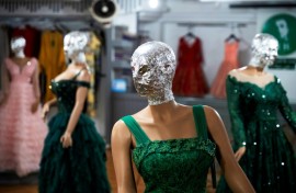 To comply with the Taliban government's edict, shopkeepers in Kabul hide the mannequins' faces in foil