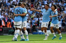 Manuel Akanji (left) scored the winning penalty as Manchester City beat Manchester United in the Community Shield
