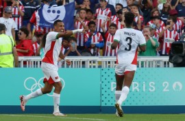 Soufiane Rahimi (L) celebrates scoring Morocco's fourth goal as they hammered Egypt 6-0 on Thursday to take Olympic men's football bronze 