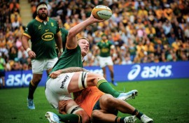 South Africa's Pieter-Steph du Toit (left) looks to offload as he is tackled by Australia's Len Ikitau 
