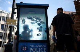 Two police officers could be seen examining the design and taking pictures of it on Sunday
